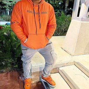 Orange salvation hoodie by thehumanorder